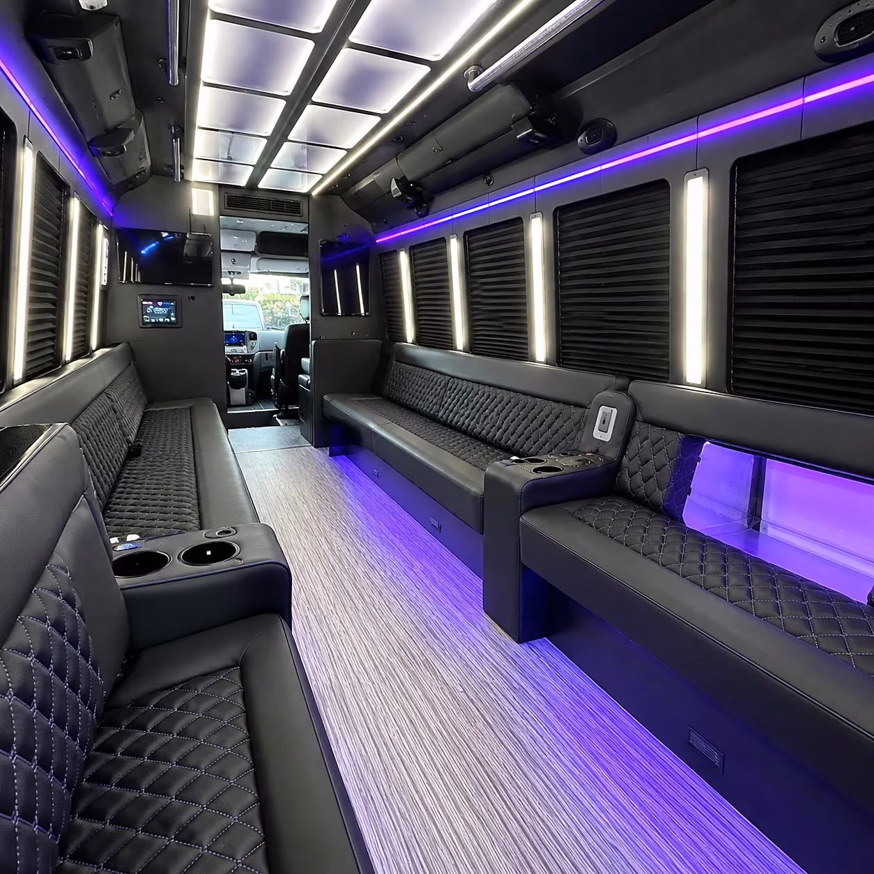 Wedding guests seated inside a party bus serving Detroit